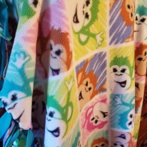 Cute and soft monkey motif tie blanket approximately 3'x4'